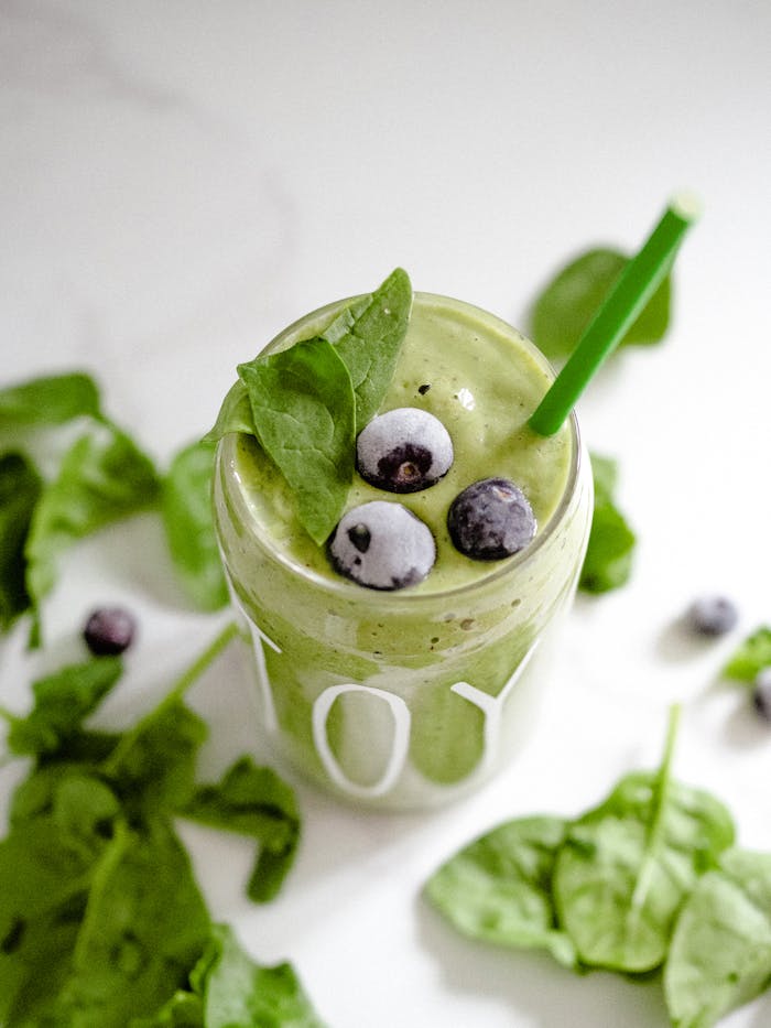 about-02 Invigorating green smoothie with spinach and blueberries, perfect for a healthy boost.